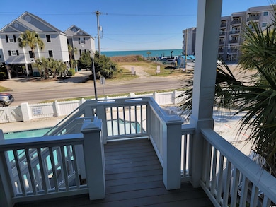 Exterior space with fence, a water view, and a com