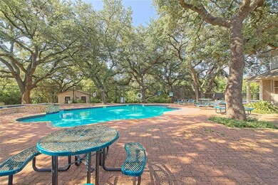 Community pool with a patio and view of scattered