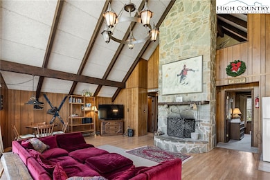 Great room with vaulted ceilings and exposed beams