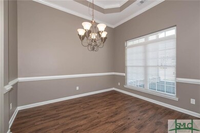 Dinning room with coffered ceilings, hard wood flo