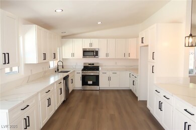 Kitchen with appliances with stainless steel finis