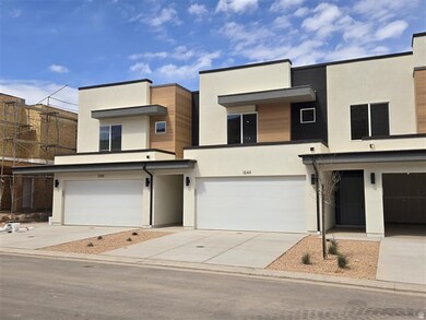 Modern home featuring concrete driveway, stucco siding, and a garage