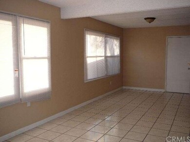 VIEW OF LIVING ROOM AND DINING ROOM