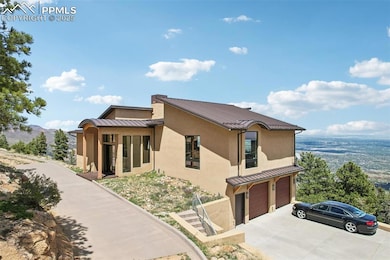 Side of the home with paved circular driveway