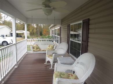 Large, relaxing front porch with ceiling fan.