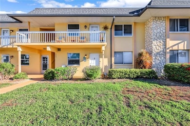 View of front of home with stucco siding, a front 