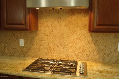 Gas Cooktop and Custom Stone Backsplash