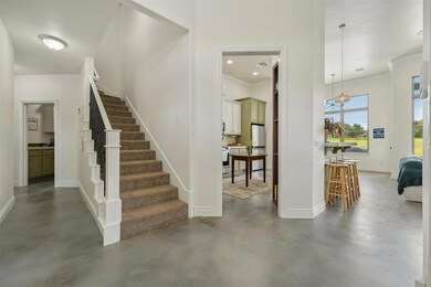 Staircase with an inviting chandelier