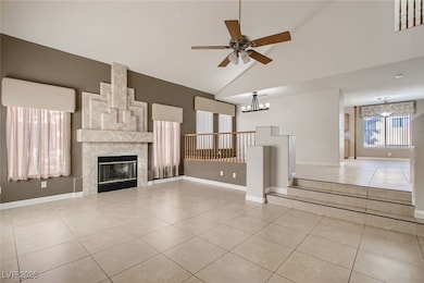 Unfurnished living room featuring a fireplace, bas
