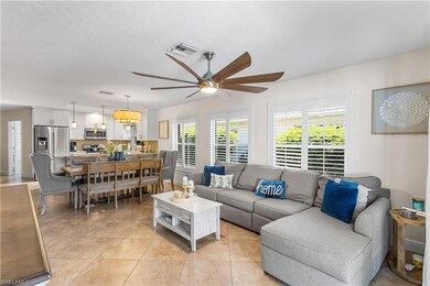 Tiled living room with ceiling fan