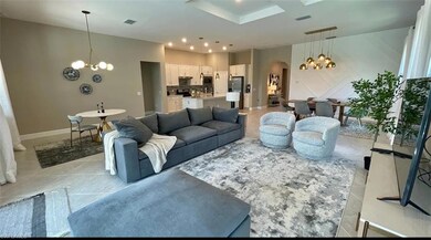 Living room featuring a notable chandelier