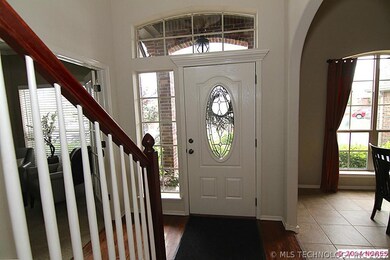 Elegant entry with hardwood floor.