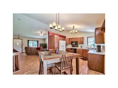 Kitchen. OPEN RAIL TO EXPANDABLE LOWER LEVEL.