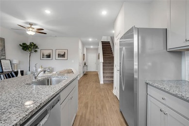 Kitchen featuring sink, light wood-type flooring, 