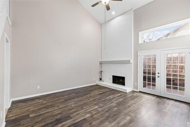 Unfurnished living room featuring a fireplace, hig