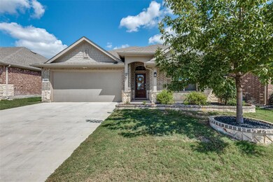 View of front of property featuring a garage and a