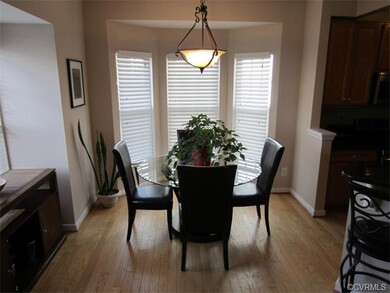 The Sun-filled Dining Room boasts Hardwood Floorin