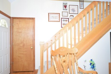 Once inside the home there is a nice entry with a coat closet.  This space opens into the main living room and has access to the open staircase to the second floor.