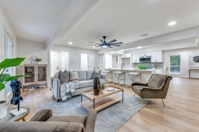 Living room featuring light hardwood / wood-style 