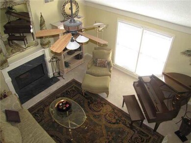 The great room features soaring vaulted ceilings w