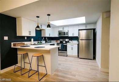 Kitchen featuring stainless steel appliances, a pe