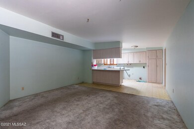 Living room opens into kitchen