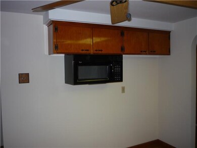 Kitchen. Microwave ready for the stove to be put b