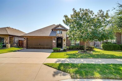 View of front facade featuring a front lawn and a 