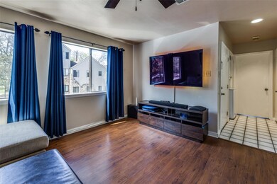 Living area with recessed lighting, baseboards, w