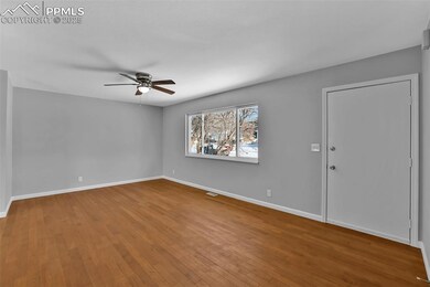 Living/great room with natural wood flooring, ceil