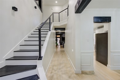 This photo features a modern hallway with light wo