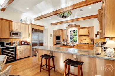 Double ovens, warming drawer, gas stove, sub zero fridge, and wine fridge!