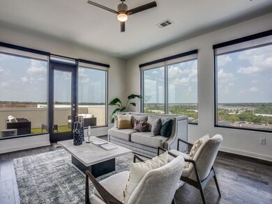 Living room featuring dark wood-type flooring, cei