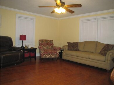 Living room is open to the dining room.  Lots of w
