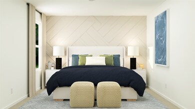 Carpeted bedroom with baseboards