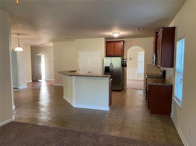 Kitchen with appliances with stainless steel finis