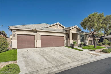 Ranch-style house with an attached garage, drivewa