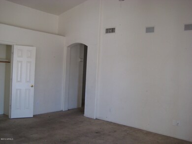 Bedroom has vaulted ceiling