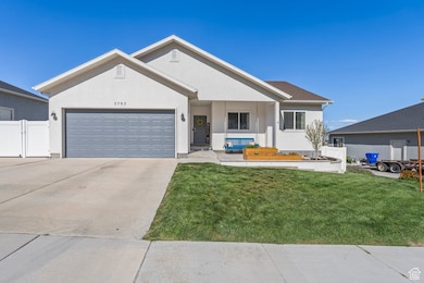 Ranch-style house featuring driveway, stucco siding, a porch, and a gate