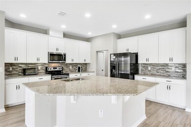 Granite Island Bar with large closet pantry just o
