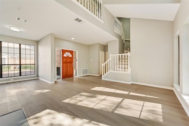View of living room, dining room and stairway