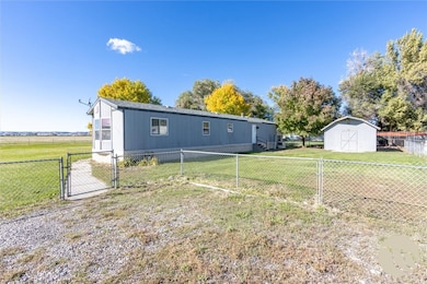 Storage shed and fenced yard