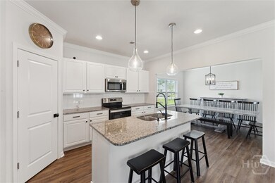 Kitchen with view of the adjacent dining room
