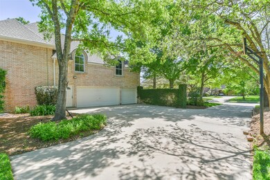 Plenty of parking is available here! The single wide drive winds behind the home to a 3 car attached garage and extended parking pad, concealed by an ivy-covered privacy wall. Being at the end of the cul de sac, guest parking can also be found on the street.