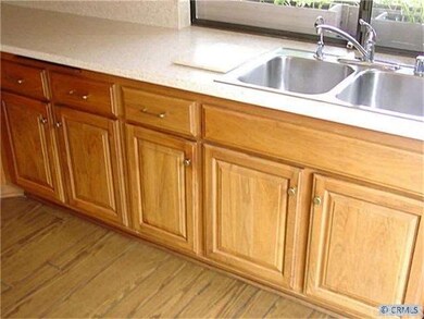 Corian Counters, Rich Wood Cabinets