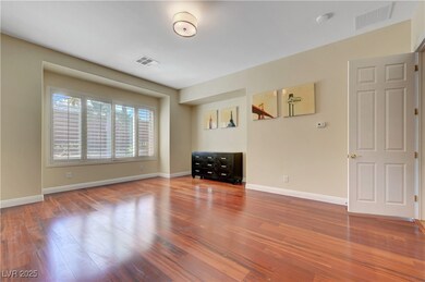Empty room with wood finished floors, baseboards,