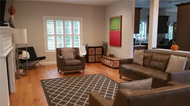 Formal living room opens to the kitchen