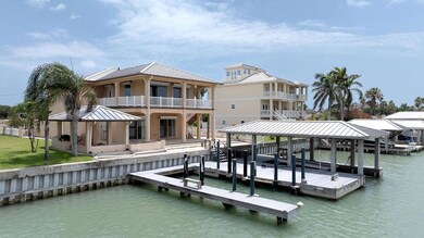 Dock with a water view, a balcony, and boat lift