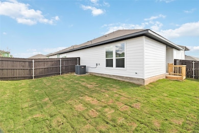 Back of house featuring a fenced backyard, centra