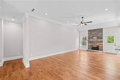 Unfurnished living room with crown molding, a ceil
